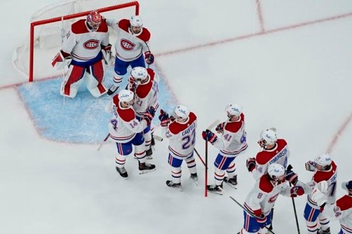 Montreal Canadiens celebrate after defeating the Vegas Golden Knights in Game 5 of an NHL hockey Stanley Cup semifinal playoff series Tuesday, June 22, 2021, in Las Vegas. THE CANADIAN PRESS/AP, John Locher