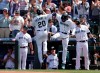 Seattle Mariners' Taylor Trammell is greeted at home by J.P. Crawford after hitting a solo home run on a pitch from Colorado Rockies starting pitcher German Marquez during the sixth inning a baseball game, Wednesday, June 23, 2021, in Seattle. (AP Photo/John Froschauer)