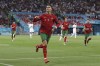 Portugal's Cristiano Ronaldo celebrates after scoring his side's second goal during the Euro 2020 soccer championship group F match between Portugal and France at the Puskas Arena in Budapest, Wednesday, June 23, 2021. (Bernadett Szabo, Pool photo via AP)