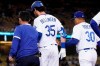 Los Angeles Dodgers' Cody Bellinger, center, is taken out of the game by manager Dave Roberts during the fifth inning of a baseball game against the Texas Rangers Friday, June 11, 2021, in Los Angeles. (AP Photo/Mark J. Terrill)