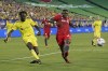 Nashville SC forward C.J. Sapong, left, takes a shot past Toronto FC defender Chris Mavinga, right, during the first half of an MLS soccer match Wednesday, June 23, 2021, in Nashville, Tenn. (AP Photo/Mark Humphrey)