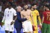 France's manager Didier Deschamps congratulates France's Karim Benzema, center, at the end of the Euro 2020 soccer championship group F match between Portugal and France at the Puskas Arena in Budapest, Wednesday, June 23, 2021. The game ended in a 2-2 draw. (Franck Fife, Pool photo via AP)
