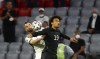 Germany's Leroy Sane, right, and Hungary's Attila Fiola challenge for the ball during the Euro 2020 soccer championship group F match between Germany and Hungary in Munich, Wednesday, June 23, 2021.(Kai Pfaffenbach/Pool via AP)