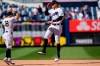 New York Yankees right fielder Aaron Judge, right, leaps with second baseman Rougned Odor (18) after the Yankees 8-1 victory over the Kansas City Royals in a baseball game, Thursday, June 24, 2021, at Yankee Stadium in New York. (AP Photo/Kathy Willens)