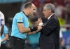 Referee Antonio Mateu Lohoz, left, talks with Portugal's manager Fernando Santos during the Euro 2020 soccer championship group F match between Portugal and France at the Puskas Arena, Budapest, Hungary, Wednesday, June 23, 2021. (AP Photo/Darko Bandic,Pool)