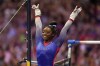 Simone Biles reacts to her performance on the uneven bars during the women's U.S. Olympic Gymnastics Trials Friday, June 25, 2021, in St. Louis. (AP Photo/Jeff Roberson)