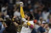 San Diego Padres' Fernando Tatis Jr. reacts with teammates after hitting a home run during the second inning of a baseball game against the Arizona Diamondbacks, Friday, June 25, 2021, in San Diego. (AP Photo/Gregory Bull)