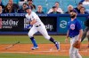 Los Angeles Dodgers' Zach McKinstry, left, heads to first as he hits a solo home run while Chicago Cubs starting pitcher Jake Arrieta watches during the third inning of a baseball game Friday, June 25, 2021, in Los Angeles. (AP Photo/Mark J. Terrill)