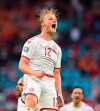 Denmark's Kasper Dolberg celebrates after scoring his side's second goal during the Euro 2020 soccer championship round of 16 match between Wales and Denmark at Johan Cruyff ArenA in Amsterdam, Netherlands, Saturday, June 26, 2021. (Olaf Kraak/Pool via AP)