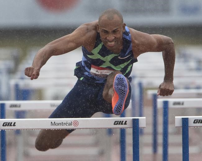 Damian Warner clears a hurdle on his way to winning the Men’s 110m hurdles final, Saturday, June 26, 2021 at the Canadian Track and Field Olympic trials in Montreal.THE CANADIAN PRESS/Ryan Remiorz