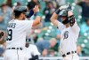 Detroit Tigers' Zack Short, right, celebrates with Isaac Paredes (19) after hitting two-run home run to break a 1-1 tie during the fifth inning of the first baseball game of a doubleheader Saturday, June 26, 2021, in Detroit. The Tigers defeated the Astros 3-1. (AP Photo/Duane Burleson)