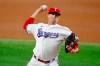 Texas Rangers starting pitcher Kyle Gibson throws against the Kansas City Royals during the first inning of a baseball game Saturday, June 26, 2021, in Arlington, Texas. (AP Photo/Michael Ainsworth)