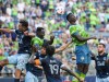 Seattle Sounders Abdoulaye Cissoko, second from right, puts a header on goal but the shot is just right of the net in the first half of an MLS soccer match against the Vancouver Whitecaps, Saturday, June 26, 2021, in Seattle. (Dean Rutz/The Seattle Times via AP)