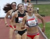 Julie-Anne Staehli, right, leads Lucia Stafford, and Mariah Kelly, left, to the finish line to win the Women's 1500m final  Sunday, June 27, 2021 at the Canadian Track and Field Olympic trials in Montreal. THE CANADIAN PRESS/Ryan Remiorz