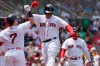 Boston Red Sox's Rafael Devers, center, celebrates his three-run home with Christian Vazquez (7) in the first inning of a baseball game against the New York Yankees, Sunday, June 27, 2021, in Boston. (AP Photo/Steven Senne)