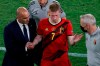 Belgium's Kevin De Bruyne leaves the match injured flanked by Belgium's manager Roberto Martine, left, during the Euro 2020 soccer championship round of 16 match between Belgium and Portugal at La Cartuja stadium in Seville, Spain, Sunday, June 27, 2021. (Jose Manuel Vidal/Pool via AP)
