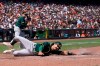 Oakland Athletics' Aramis Garcia slides home to score against the San Francisco Giants during the sixth inning of a baseball game in San Francisco, Sunday, June 27, 2021. (AP Photo/Jeff Chiu)