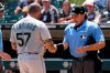 Home Plate umpire Phil Cuzzi, right, talks with Seattle Mariners relief pitcher Hector Santiago during the fifth inning in the first baseball game of a doubleheader against the Chicago White Sox in Chicago, Sunday, June 27, 2021. Santiago was ejected by Cuzzi. (AP Photo/Nam Y. Huh)
