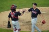Cleveland Indians relief pitcher James Karinchak, right, and catcher Austin Hedges celebrate the team's 4-1 win over the Minnesota Twins in a baseball game, Thursday, June 24, 2021, in Minneapolis. Karinchak picked up the save. (AP Photo/Jim Mone)