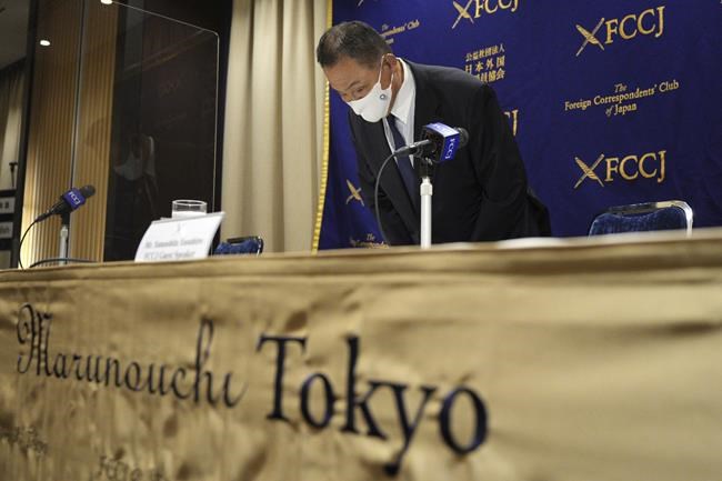 Yasuhiro Yamashita, President of the Japanese Olympic Committee, bows prior to his press conference Monday, June 28, 2021, in Tokyo, ahead of the opening of Tokyo 2020 Olympic Games on July 23. (AP Photo/Eugene Hoshiko)