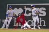 Kansas City Royals shortstop Nicky Lopez (8) gets the force at second on Boston Red Sox's Enrique Hernandez (5) as he throws to first to complete the double play on J.D. Martinez during the fifth inning of a baseball game at Fenway Park, Monday, June 28, 2021, in Boston. (AP Photo/Mary Schwalm)