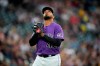Colorado Rockies starting pitcher German Marquez heads to the dugout after retiring the Pittsburgh Pirates in the sixth inning of a baseball game Tuesday, June 29, 2021, in Denver. (AP Photo/David Zalubowski)