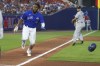Toronto Blue Jays' Vladimir Guerreo Jr. scores from third on a ball hit by Cavan Biggio during the fifth inning of the team's baseball game against the Seattle Mariners, Tuesday, June 29, 2021, in Buffalo, N.Y. (AP Photo/Jeffrey T. Barnes)