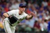 Milwaukee Brewers' Brent Suter tosses the ball to get a base runner out at first base during the seventh inning of a baseball game against the Chicago Cubs Tuesday, June 29, 2021, in Milwaukee. (AP Photo/Aaron Gash)