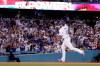 Los Angeles Dodgers' Max Muncy gestures as he rounds third after hitting a solo home run during the third inning of a baseball game against the San Francisco Giants Tuesday, June 29, 2021, in Los Angeles. (AP Photo/Mark J. Terrill)
