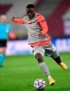 FILE - In this file photo dated Wednesday, Dec. 9, 2020, Salzburg's Patson Daka runs with the ball during the Champions League group A soccer match against Atletico Madrid in Salzburg, Austria. Premier League Leicester has signed 22-year-old striker Patson Daka from Red Bull Salzburg on a five-year contract starting Thursday July 1, 2021, after the Zambia international led the Austrian league in goals last season.(AP Photo/Andreas Schaad, FILE)