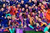 FILE - In this Sunday, May 16, 2021 file photo, Barcelona players pose for a photograph with the trophy after winning the UEFA Women's Champions League final soccer match against Chelsea in Gothenburg, Sweden. European women’s soccer will gain new exposure when all Women’s Champions League games from the group stage are broadcast live on YouTube by DAZN for the next two seasons, it was announced Wednesday, June 30, 2021. In the second half of the four-year deal, the number of free games will drop to 19 games including the final. The games will be streamed worldwide except in China, and the Middle East and North Africa region (AP Photo/Martin Meissner)