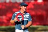 FILE - Bryson DeChambeau holds the Rocket Mortgage Classic golf tournament trophy at Detroit Golf Club in Detroit, in this Sunday, July 5, 2020, file photo. DeChambeau is back at Detroit Golf Club to defend his Rocket Mortgage Classic title. (AP Photo/Carlos Osorio, File)