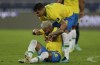 Brazil's Thiago Silva, top, helps teammate Neymar during a Copa America soccer match against Colombia at Nilton Santos stadium in Rio de Janeiro, Brazil, Wednesday, June 23, 2021. (AP Photo/Silvia Izquierdo)