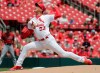 St. Louis Cardinals starting pitcher Kwang Hyun Kim (33) sets to deliver a pitch in the first inning of a baseball game against the Arizona Diamondbacks, Wednesday, June 30, 2021, in St. Louis. (AP Photo/Tom Gannam)