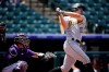 Pittsburgh Pirates' Bryan Reynolds connects for a solo home run off Colorado Rockies starting pitcher Jon Gray in the first inning of a baseball game Wednesday, June 30, 2021, in Denver. (AP Photo/David Zalubowski)