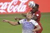 Toronto FC forward Ayo Akinola, rear, scores a goal on a header over Orlando City defender Robin Jansson during the first half of an MLS soccer match Saturday, June 19, 2021, in Orlando, Fla. (AP Photo/Phelan M. Ebenhack)