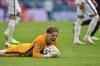 England's goalkeeper Jordan Pickford reacts after saving a shot during the Euro 2020 soccer championship round of 16 match between England and Germany at Wembley Stadium in England, Tuesday June 29, 2021. (Justin Tallis, Pool Photo via AP)