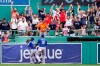 Fans cheer after Kansas City Royals center fielder Jarrod Dyson jumped against the bullpen wall in an effort to catch Boston Red Sox's Danny Santana's three-run homer in the fourth inning of a baseball game at Fenway Park, Thursday, July 1, 2021, in Boston. Royals right fielder Jorge Soler (12) helps Dyson get his balance. (AP Photo/Elise Amendola)