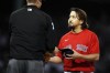 Boston Red Sox's Hirokazu Sawamura, right, takes his cap back from umpire Jordan Baker after it was checked for sticky substances during the fourth inning of a baseball game against the New York Yankees, Friday, June 25, 2021, in Boston. (AP Photo/Michael Dwyer)