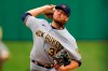 Milwaukee Brewers starting pitcher Corbin Burnes delivers during the first inning of the team's baseball game against the Pittsburgh Pirates in Pittsburgh, Thursday, July 1, 2021. (AP Photo/Gene J. Puskar)