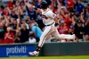 Atlanta Braves third baseman Austin Riley gestures as he rounds the bases after hitting a two-run home run in the first inning of a baseball game against the New York Mets Thursday, July 1, 2021, in Atlanta. (AP Photo/John Bazemore)