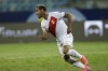 Peru's Miguel Trauco celebrates after scoring the winning goal and defeating Paraguay 4-3 in a penalty shootout during a Copa America quarterfinal soccer match at the Olimpico stadium in Goiania, Brazil, Friday, July 2, 2021 (AP Photo/Andre Penner)
