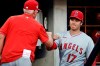 Los Angeles Angels' Shohei Ohtani fist-bumps manager Joe Maddon in the dugout before the team's baseball game against the New York Yankees on Wednesday, June 30, 2021, in New York. (AP Photo/Adam Hunger)