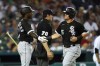 Chicago White Sox's Andrew Vaughn, right, celebrates scoring with Tim Anderson against the Detroit Tigers in the seventh inning of a baseball game in Detroit, Friday, July 2, 2021. (AP Photo/Paul Sancya)