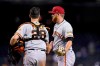 San Francisco Giants relief pitcher Zack Littell, right, celebrates with catcher Buster Pose after the final out in the team's baseball game against the Arizona Diamondbacks on Friday, July 2, 2021, in Phoenix. The Giants won 11-4. (AP Photo/Ross D. Franklin)