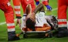 Italy's Leonardo Spinazzola covers his face after injuring during the Euro 2020 soccer championship quarterfinal match between Belgium and Italy at at the Allianz Arena in Munich, Germany, Friday, July 2, 2021. (AP Photo/Philipp Guelland, Pool Photo via AP)