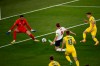 England's Harry Kane, center, scores his side's opening goal during the Euro 2020 soccer championship quarterfinal match between Ukraine and England at the Olympic stadium in Rome, Italy, Saturday, July 3, 2021. (Alessandro Garofalo/Pool Via AP)