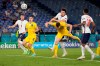 England's Harry Maguire, center top, scores his side's second goal during the Euro 2020 soccer championship quarterfinal match between Ukraine and England at the Olympic stadium in Rome at the Olympic stadium in Rome, Italy, Saturday, July 3, 2021. (AP Photo/Alessandra Tarantino, Pool)