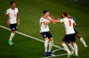 England's Harry Kane, right, celebrates after scoring his side's third goal during the Euro 2020 soccer championship quarterfinal match between Ukraine and England at the Olympic stadium in Rome, Italy, Saturday, July 3, 2021. (Alessandro Garofalo/Pool Via AP)