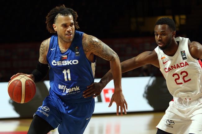 Canada's Andrew Wiggins, right, tries block the pass by Czech Republic's Blake Schilb during first half FIBA Men's Olympic Qualifying semi-final basketball action at Memorial Arena in Victoria, Saturday, July 3, 2021. THE CANADIAN PRESS/Chad Hipolito